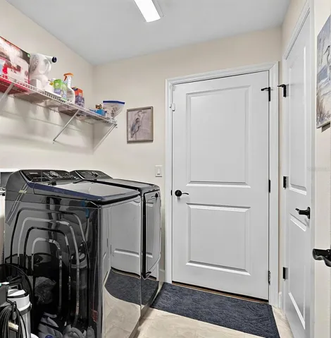 Laundry room with shelving