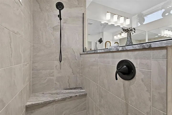 Walk in shower with black matter fixtures