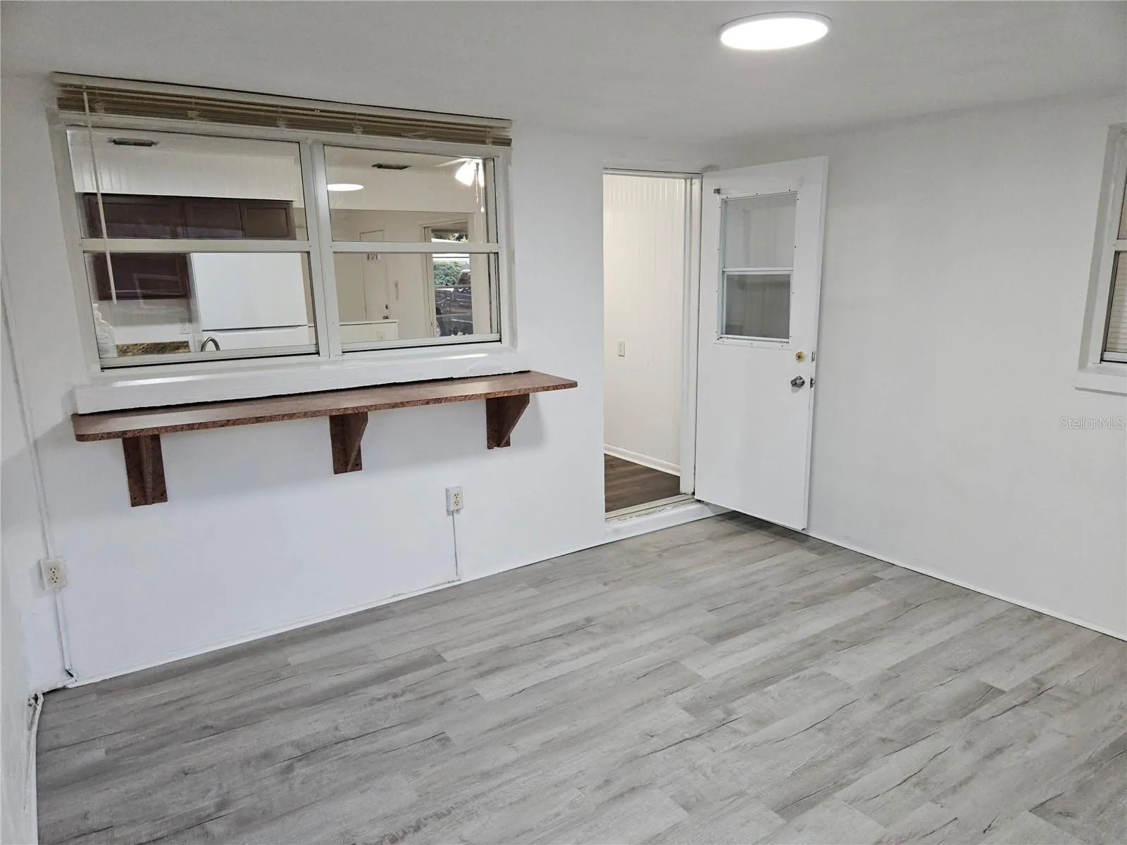 View of Florida Room with doorway to Kitchen