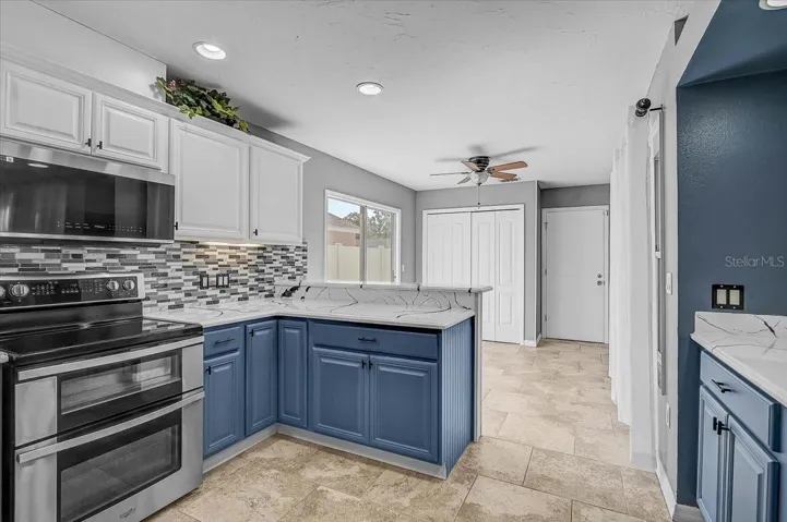 Kitchen Looking into Dinette and Sliding Glass Doors to Side Patio,