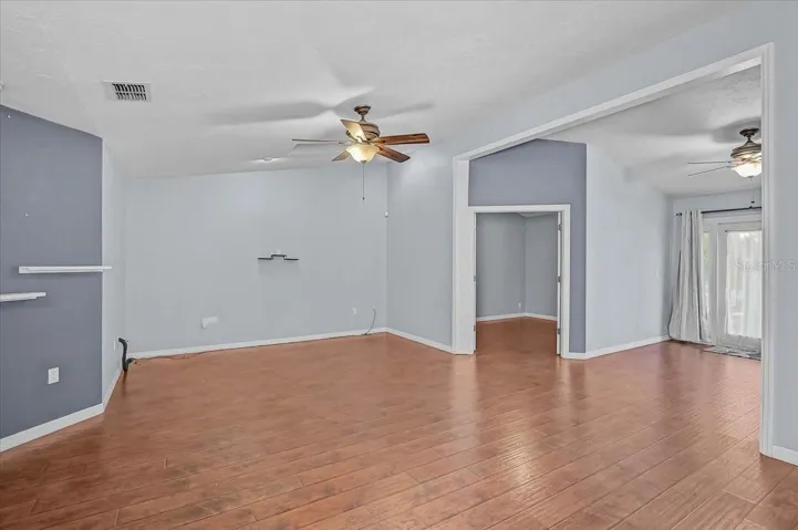 Living Room, Den with Double French Doors, Open Bonus Room to Exterior French Doors to Back Patio and Pond.