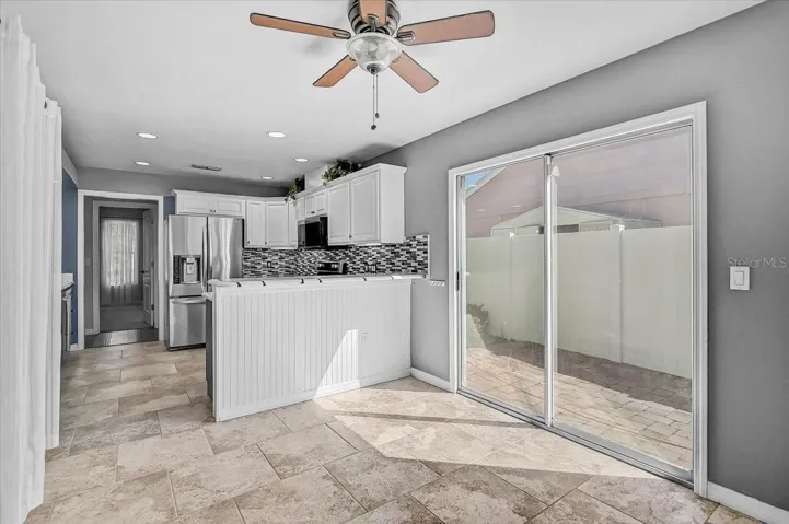 Dinette Looking into Kitchen and Side Patio 35' x 9'