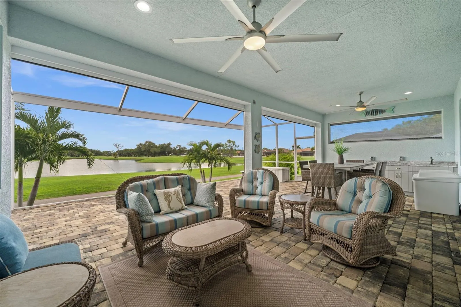 Electric hurricane shutters provide added protection to your expansive outdoor oasis.