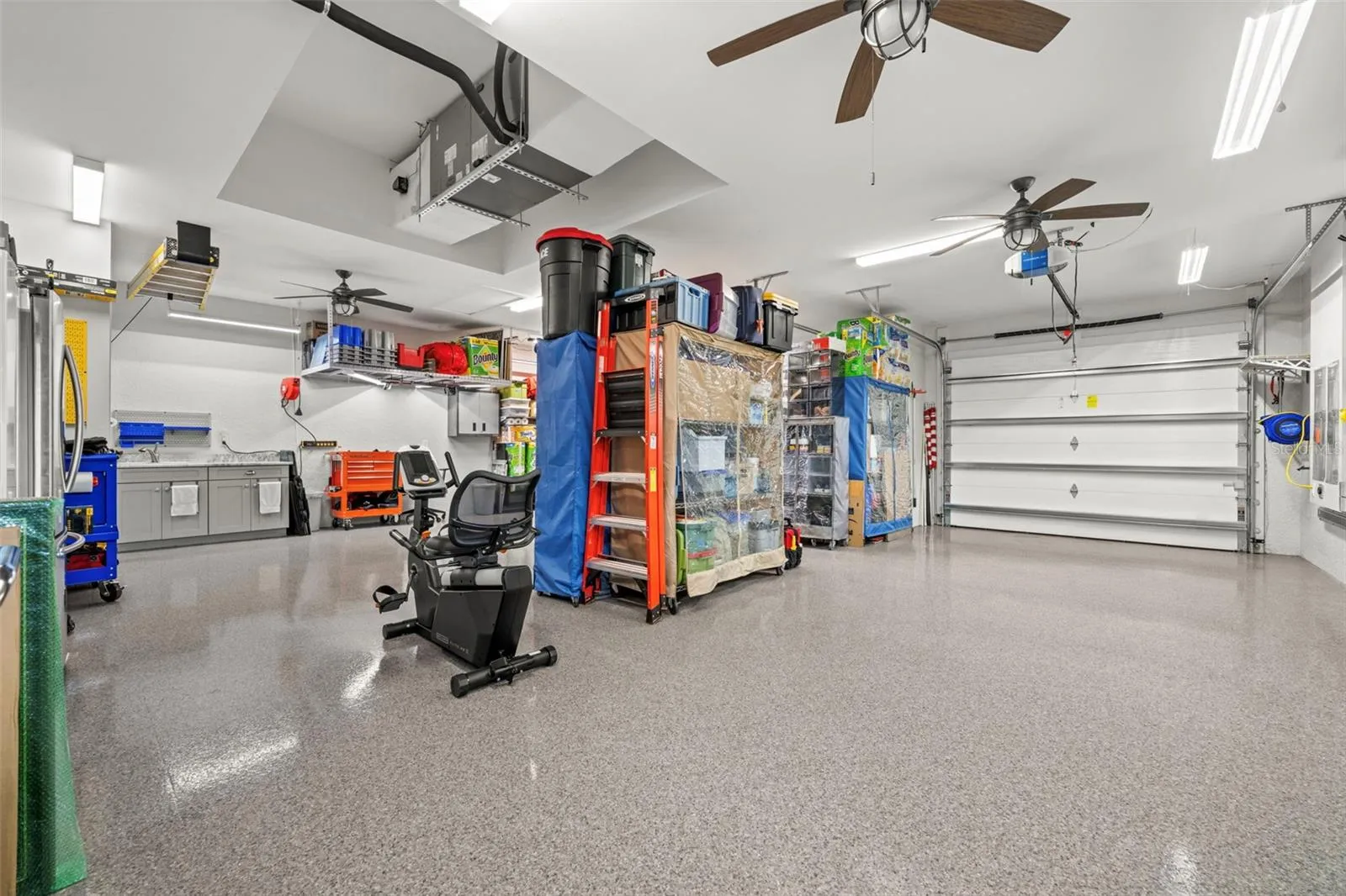 The very oversized 3 car garage is 1,039 SF! There are also 2 large hanging storage racks.