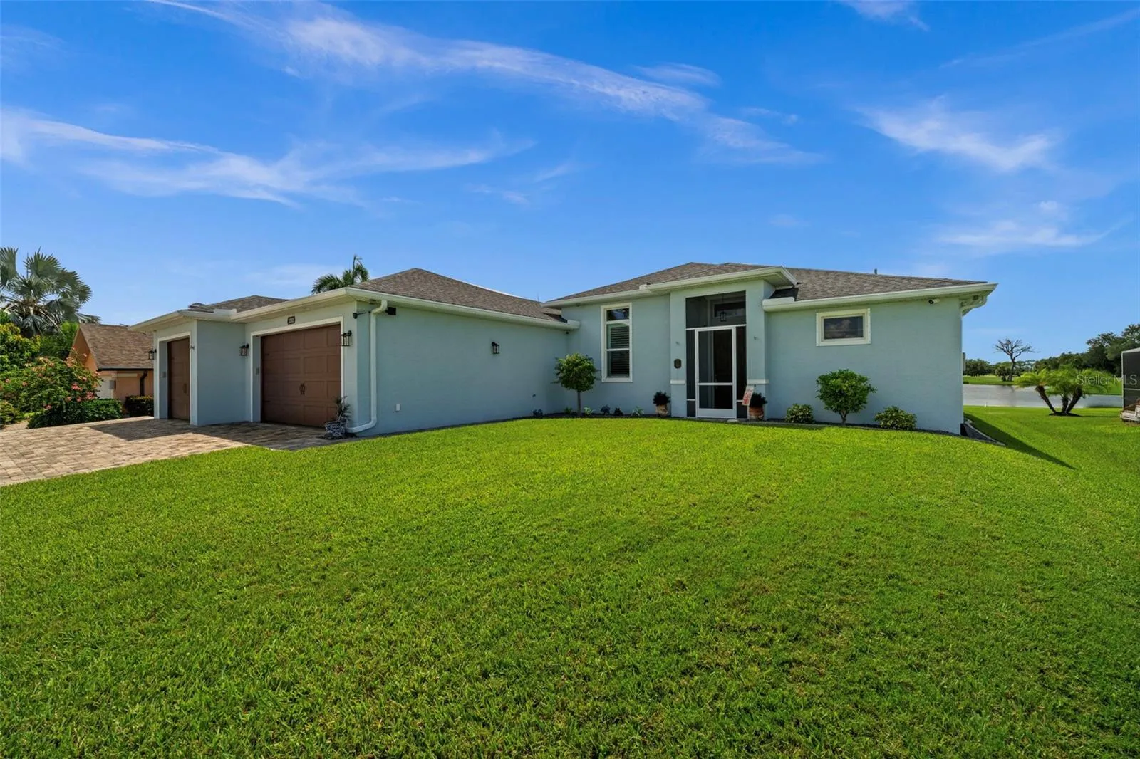 The roof is new(er). The lawn is lovely. The SW Florida skies are blue.