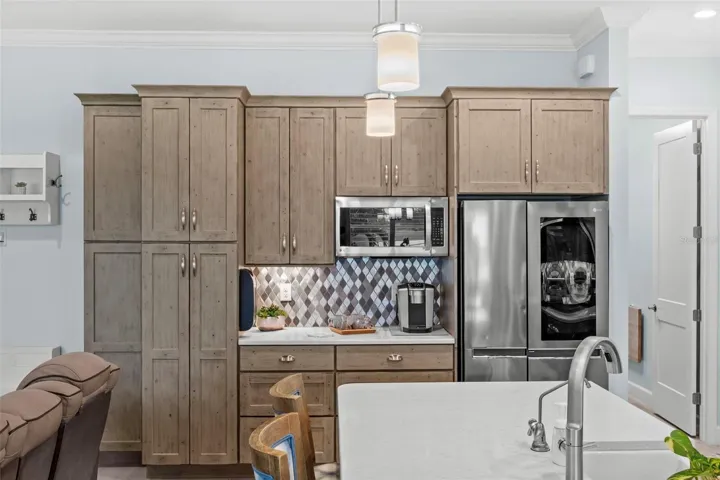 Abundant solid wood cabinetry. A coffee bar, too.