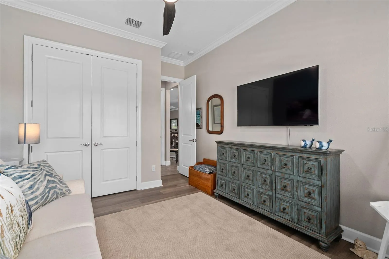 Bedroom 3 with a closet organization system.