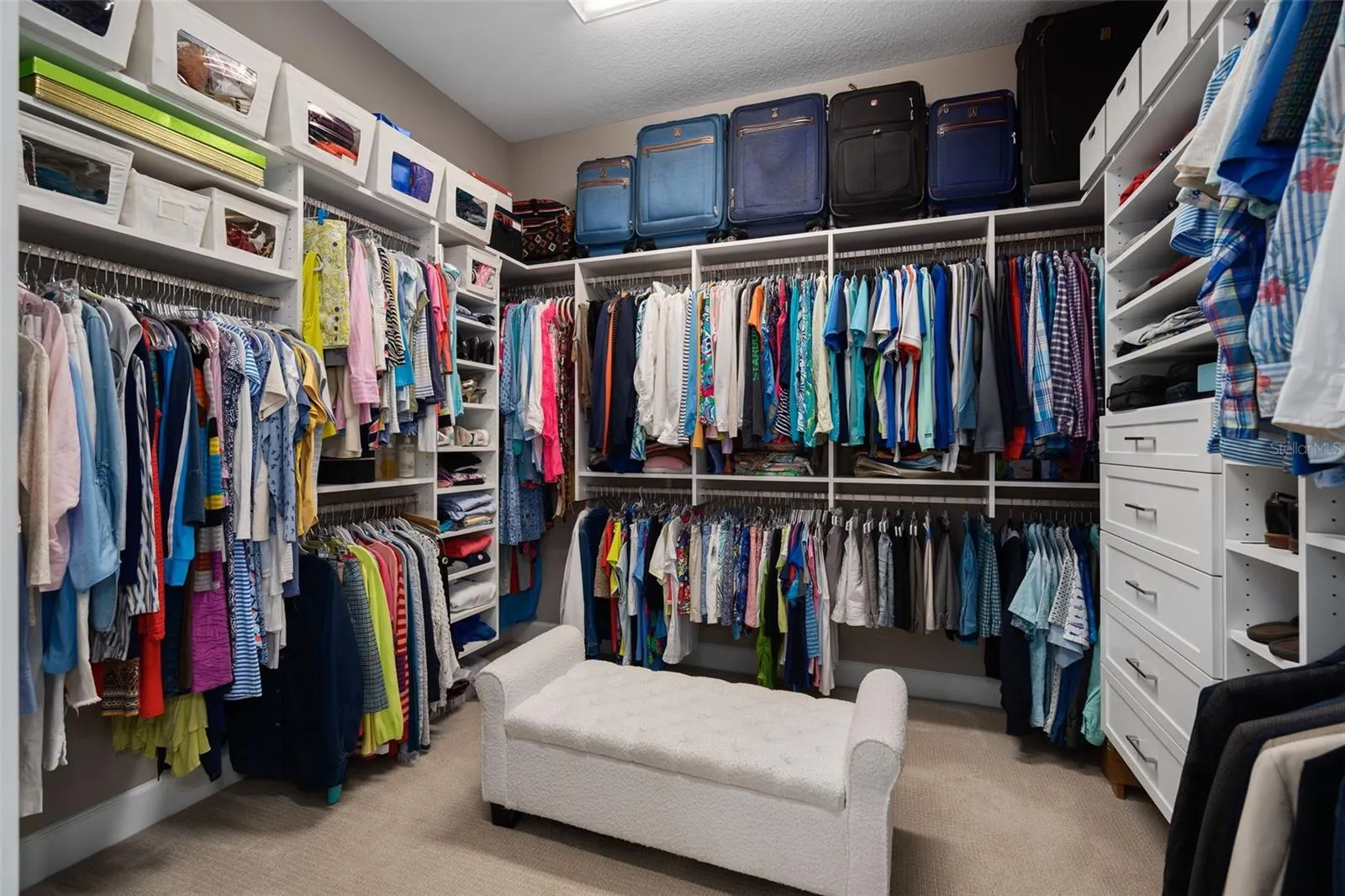 Primary Suite custom organized closet.