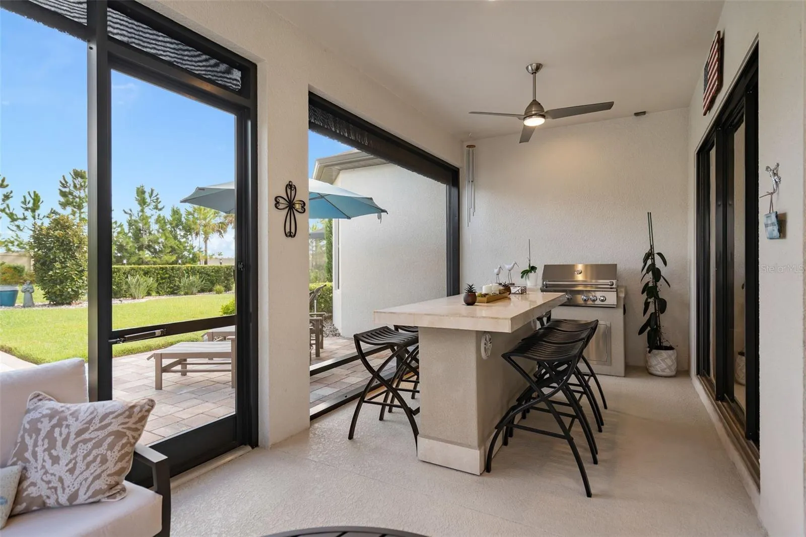 Enjoy cooking on the outdoor grill while taking advantage of the Florida weather. Wait until you see the back yard.