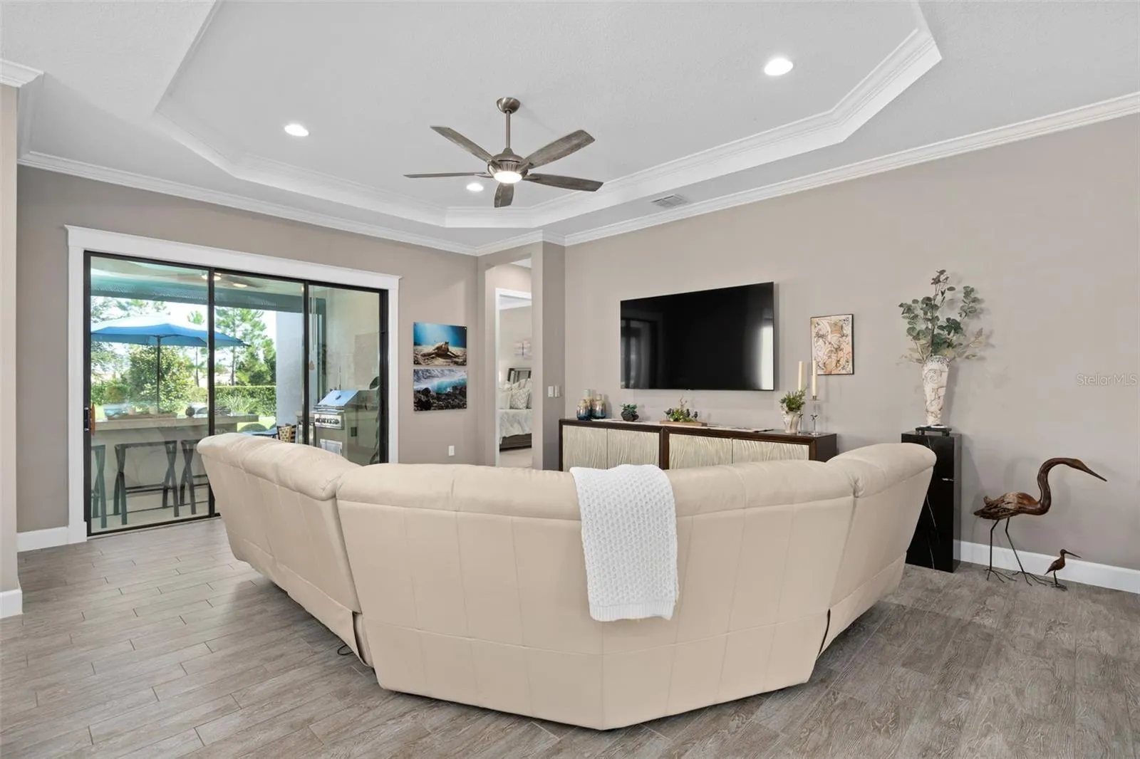 Great room with a view of the screened lanai and the rear yard.