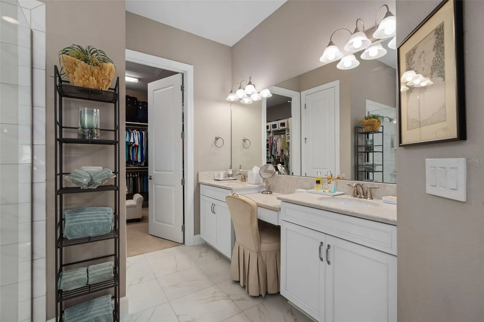 Primary En-Suite offering a larger walk-in closet, separate water closet and a walk-in shower.