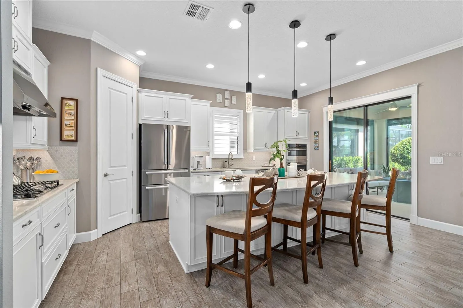 Under cabinet lighting grace the Quartz Countertops and the ceramic backsplash.