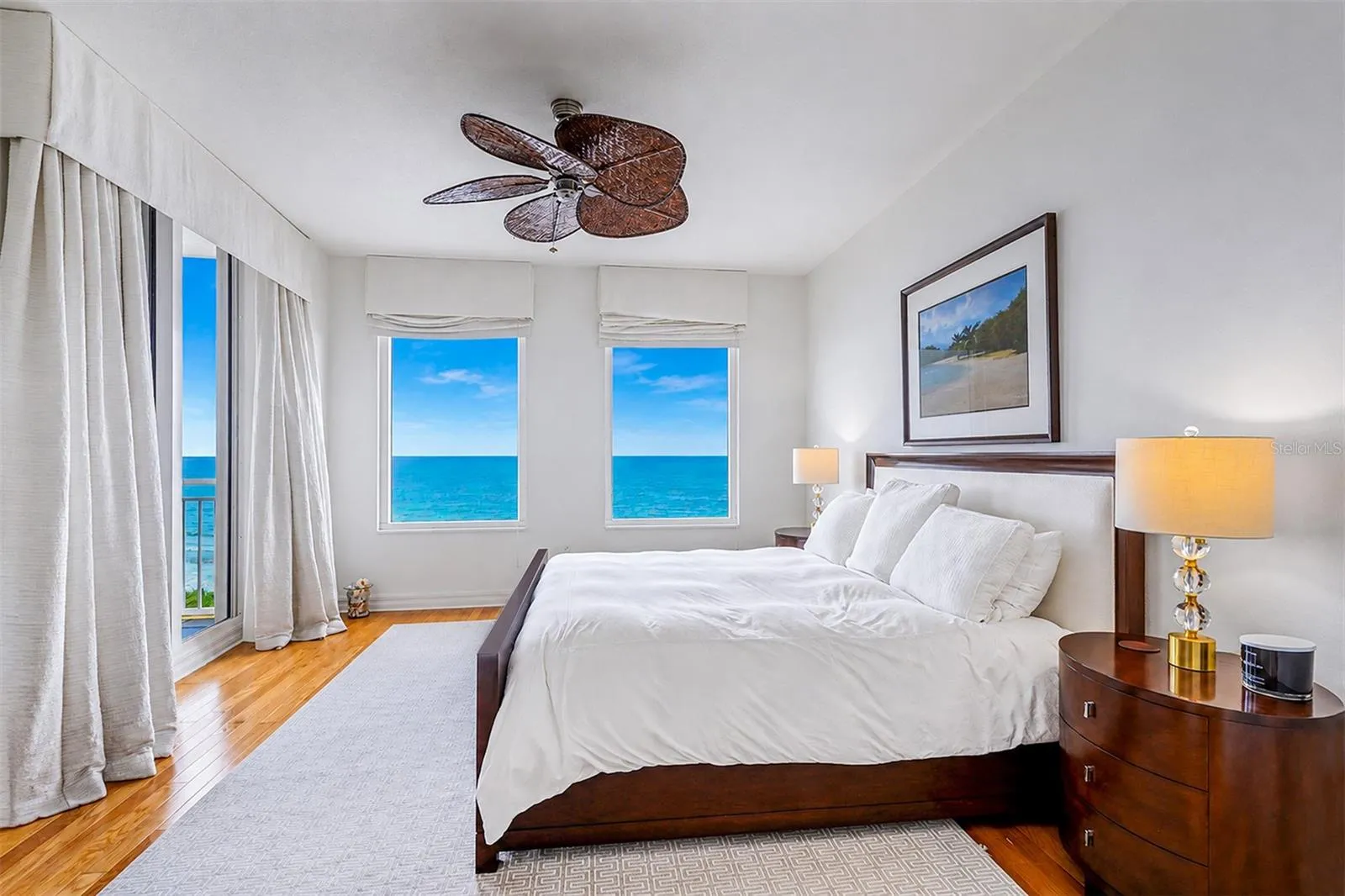 .. Master Bedroom Suite - Gulf Front. Wood Floors - High Impact Sliders with Balcony Access.