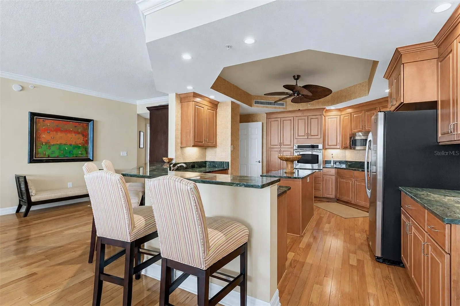 ... Kitchen Has Updated Granite - Tons of Cabinetry Space - Prep Island - GE Stainless Appliance Package &amp; Newly Refurbished Bar Stools.