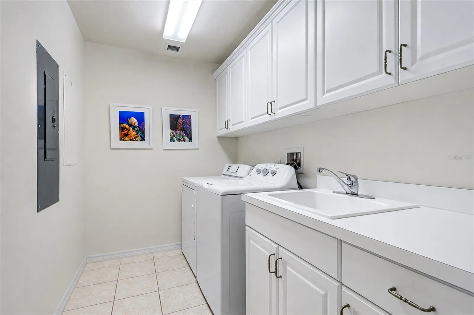 ... Large Laundry Room 9'6"  X 6' is Located off the Kitchen Area in the Transitional Space Separating the Front Part of the Condo and the Guest Quarters in the Rear.