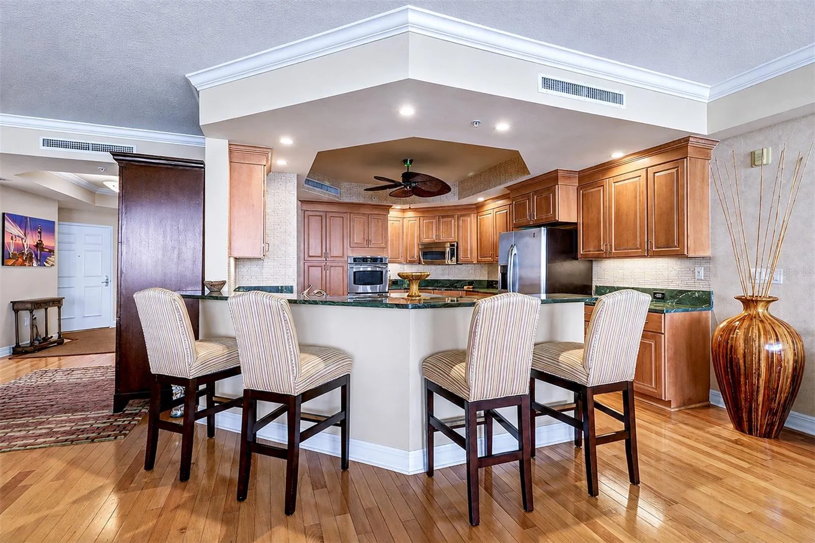 ... Kitchen Size  in Perfect Proportion to Great Room . Wood Floors Thru Out Unit Provide a Warm Coastal Comfortable Living Atmosphere.