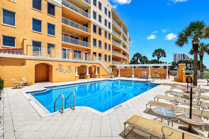 ...   Numerous Lounging Areas at the Sereno.. Stairs with White Railings Lead up to 2nd Floor Landing with  Clubhouse &amp; Gym Facility.