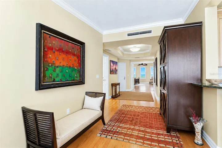 ... Solid Wood Floors Thru Out Condo Convey a Soft Welcoming Aura ...The Larger of The Guest Suites Accessed Thru the Double Open Parlor Doors on East side of Residence 404.. I've seen this Large Guest Suite Double  as a Home Office / Music Room / Parlor etc..