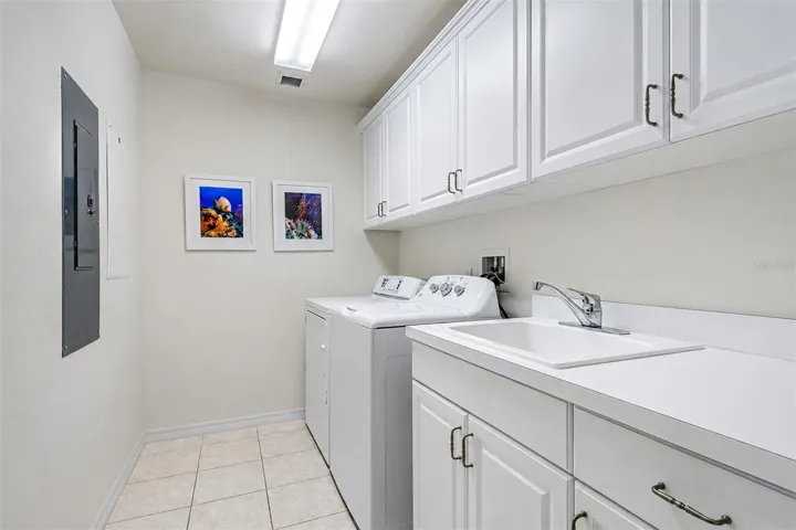 ... Large Laundry Room 9'6"  X 6' is Located off the Kitchen Area in the Transitional Space Separating the Front Part of the Condo and the Guest Quarters in the Rear.