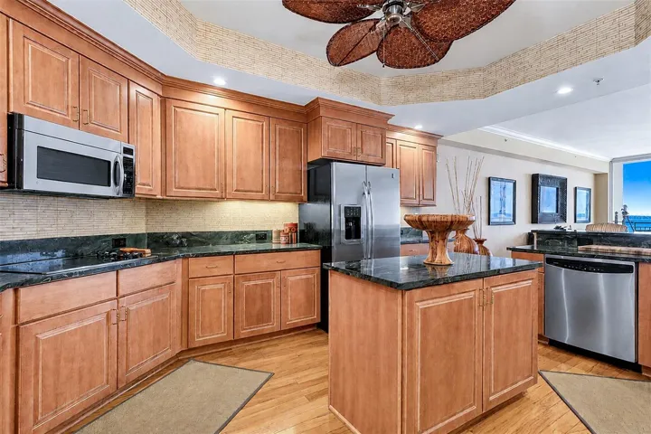 .. Kitchen Pic 2... Solid Wood Cabinetry - Granite - GE Profile Appliance Package - Prep Island - Water View.