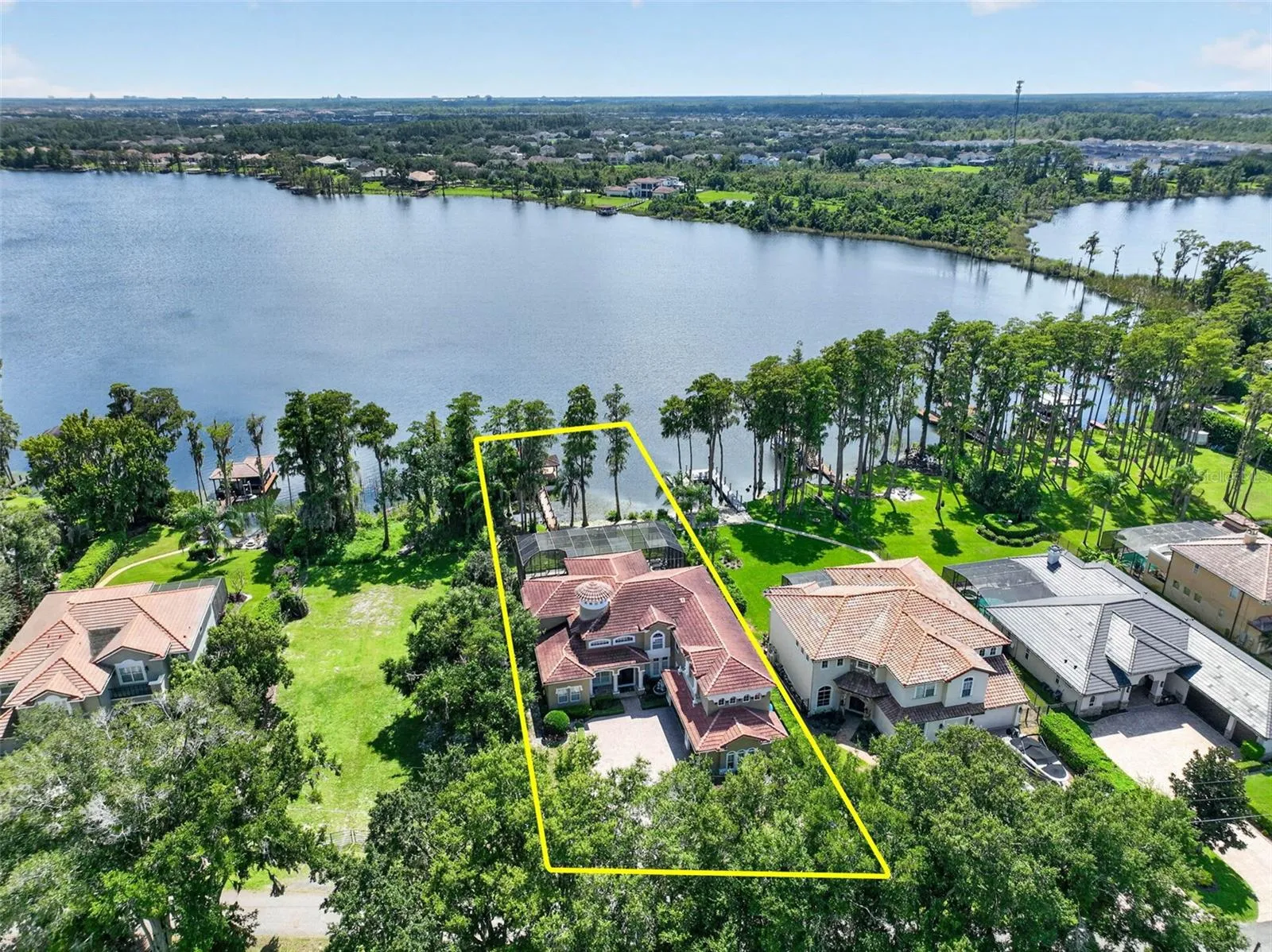 Elevated property view highlighting the expansive lot and direct lake frontage.