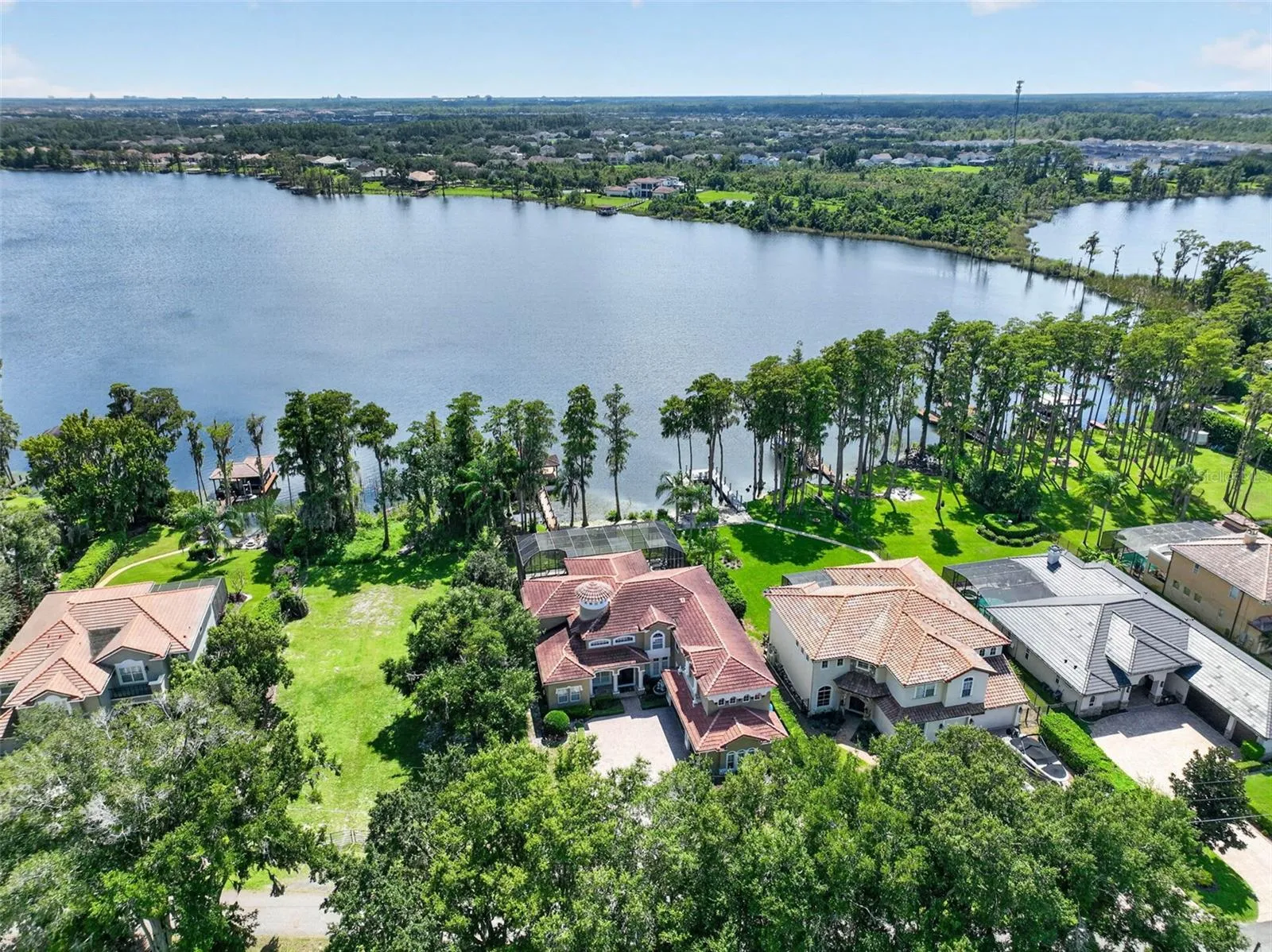 Wide aerial showcasing the residence along the Lake Sawyer shoreline.