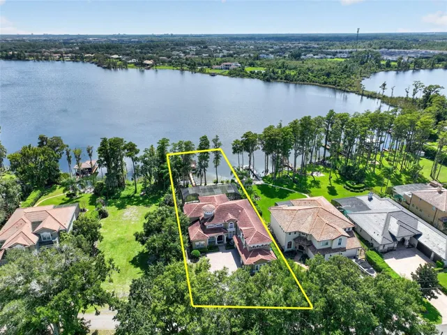 Elevated property view highlighting the expansive lot and direct lake frontage.