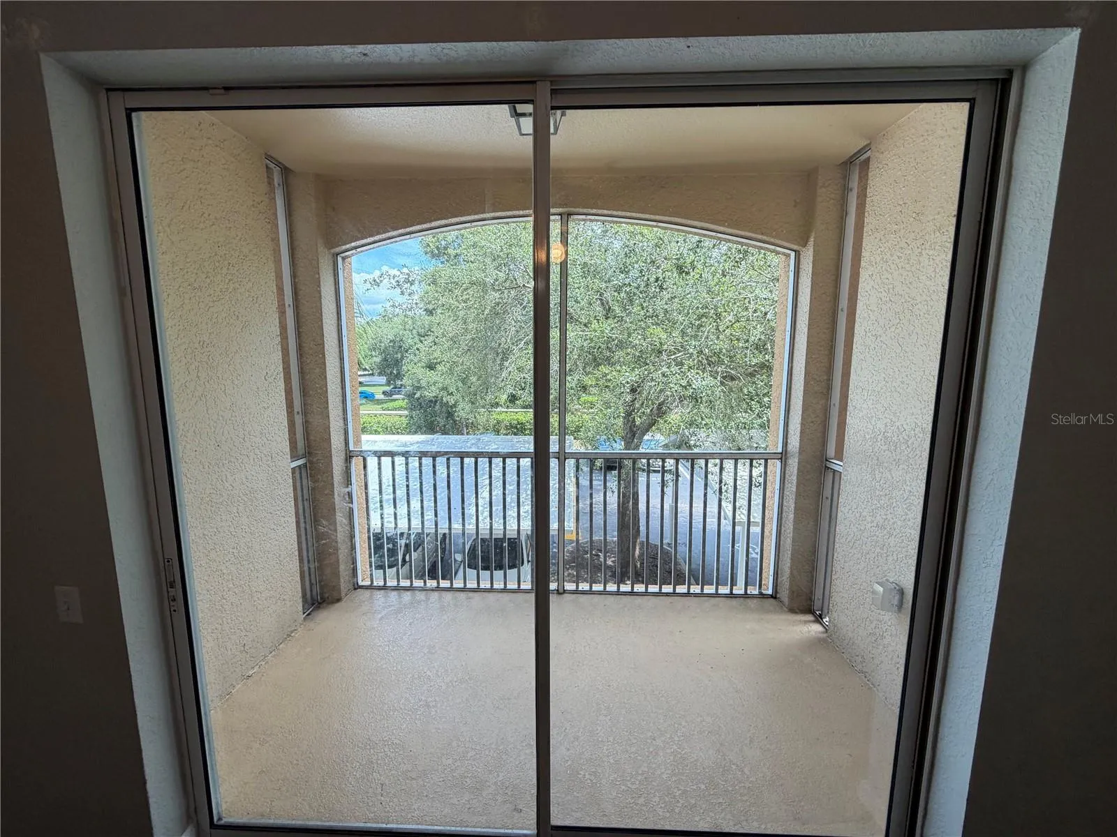 Covered patio with a screened-in lanai area.