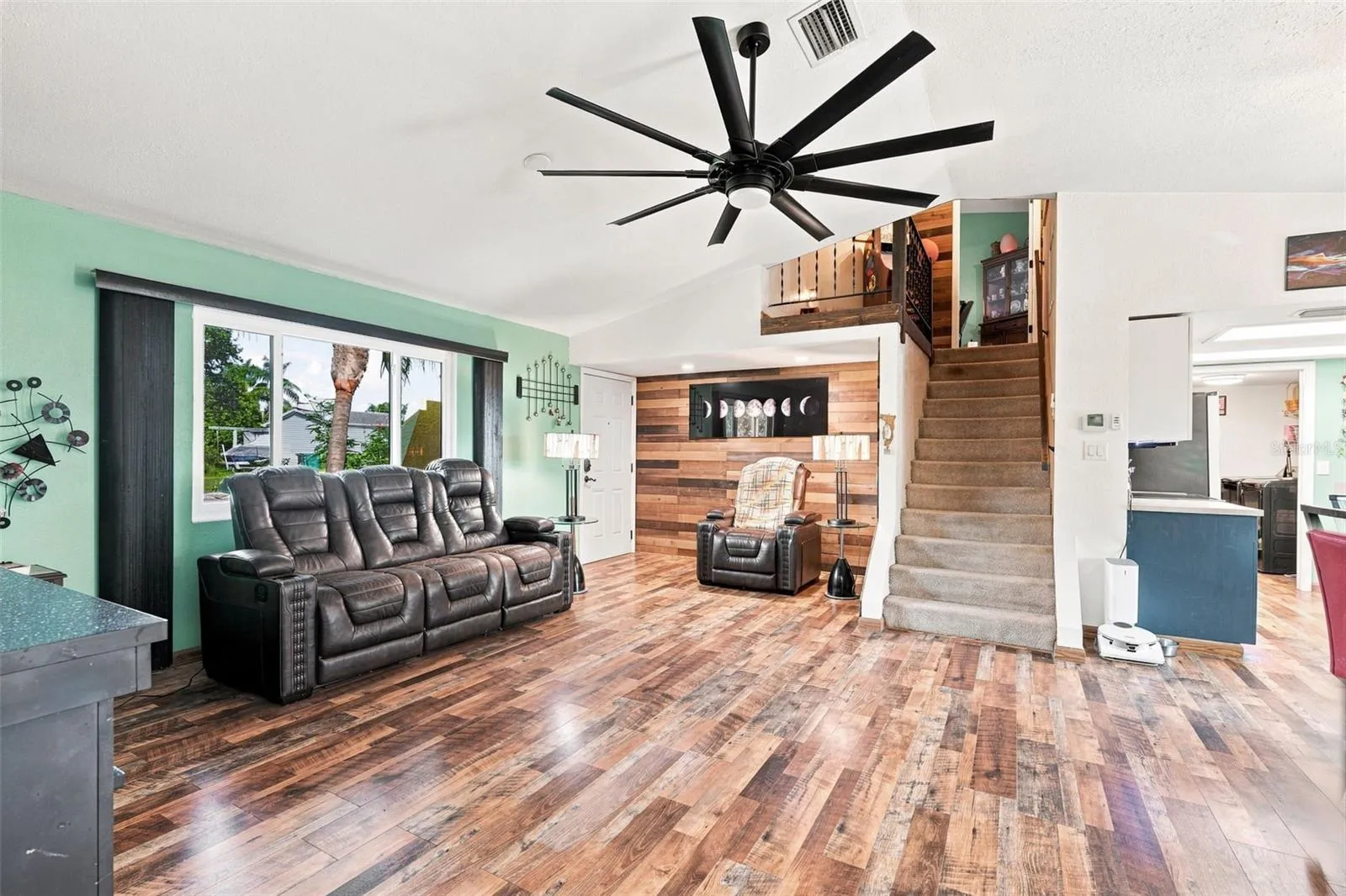 Designer Fan And Open Concept Perfect For Entertaining