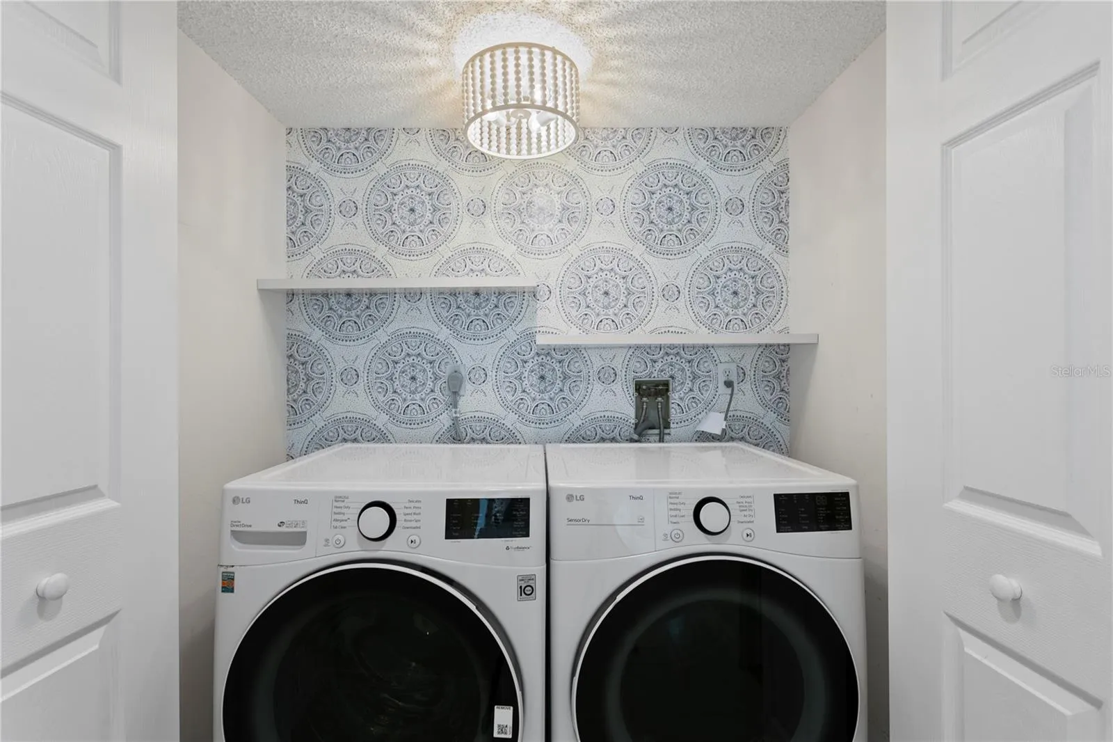 In-residence laundry has been thoughtfully enhanced with a full-size washer and dryer plus additionalwell-organized storage.
