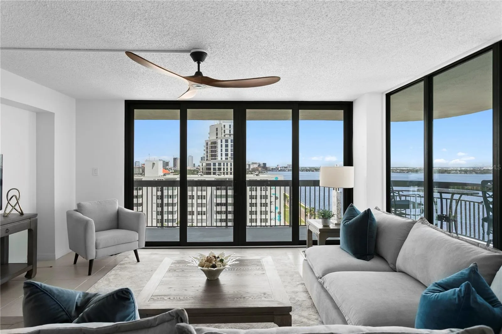 Generous living spaces flow seamlessly onto a wraparound terrace, extending everyday living and entertaining outdoors while capturing scenic Bay views from morning through sunset.