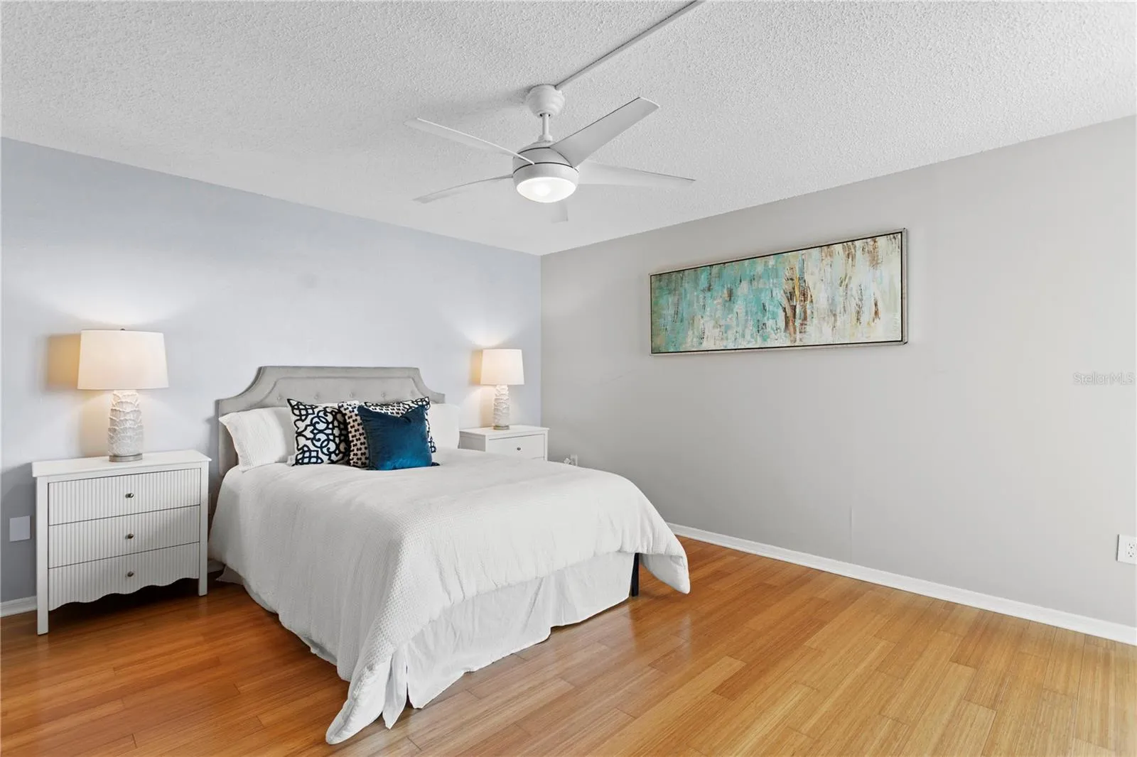 the spacious primary suite offers terrace access and beautiful Bay views.