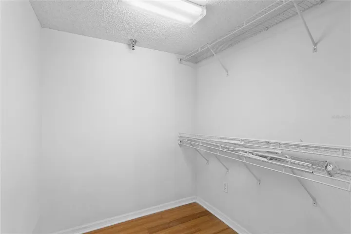 Walk-in closet designed to maximize storage and functionality.