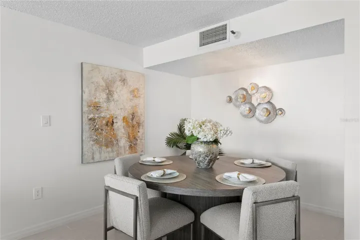 Spacious open-concept layout with a designated dining area and seamless flow throughout.