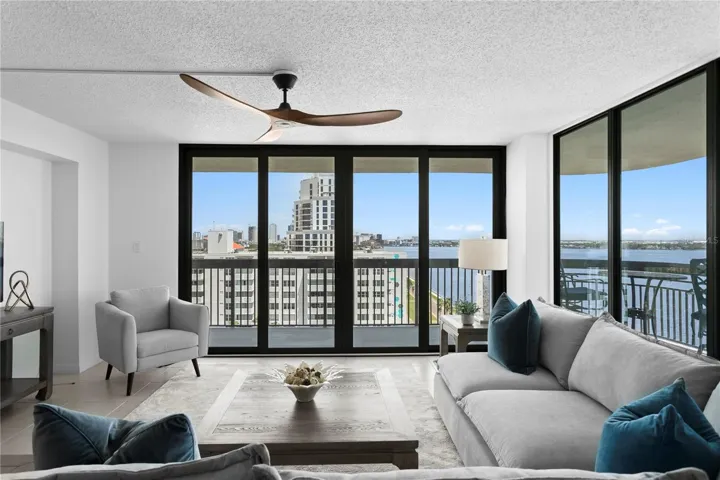 Generous living spaces flow seamlessly onto a wraparound terrace, extending everyday living and entertaining outdoors while capturing scenic Bay views from morning through sunset.