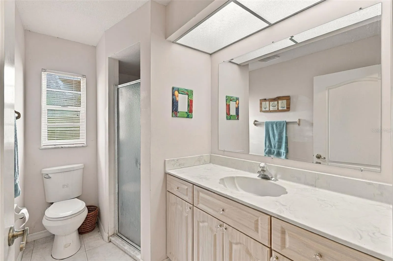 Guest Bathroom with Large Vanity and Walk-In Shower