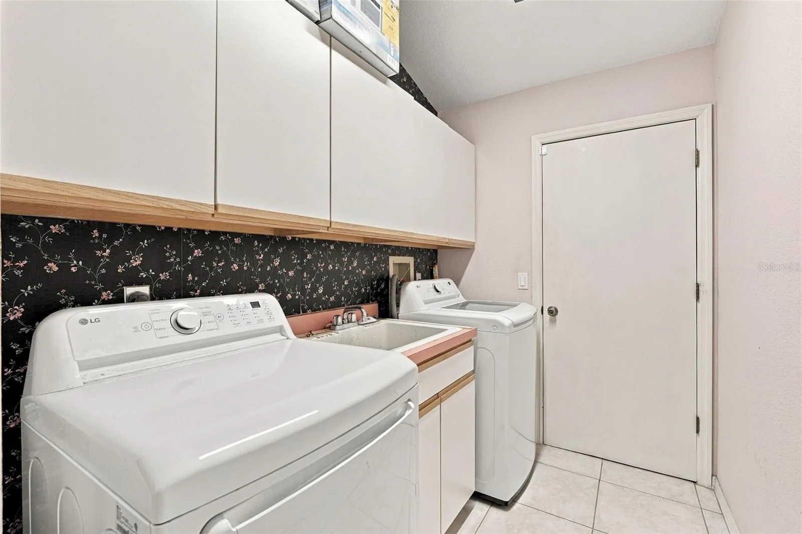 Laundry Room Offers Utility Sink and Extra Storage