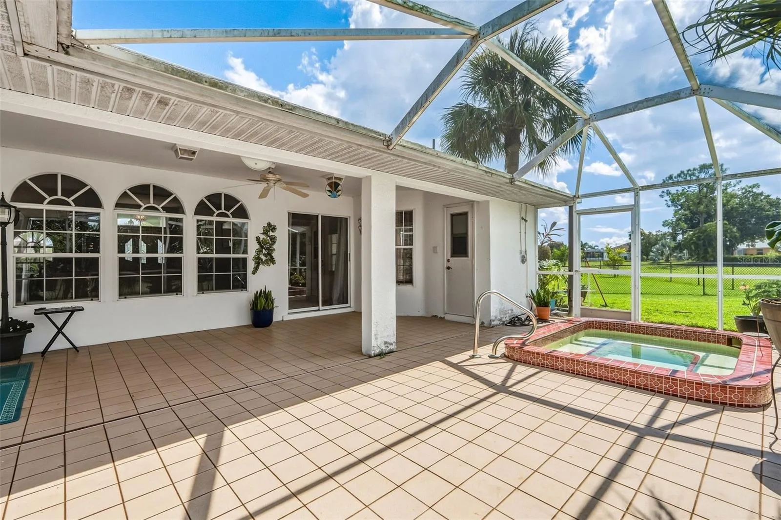 Oversized In-Ground Spa Surrounded by Spacious Lanai