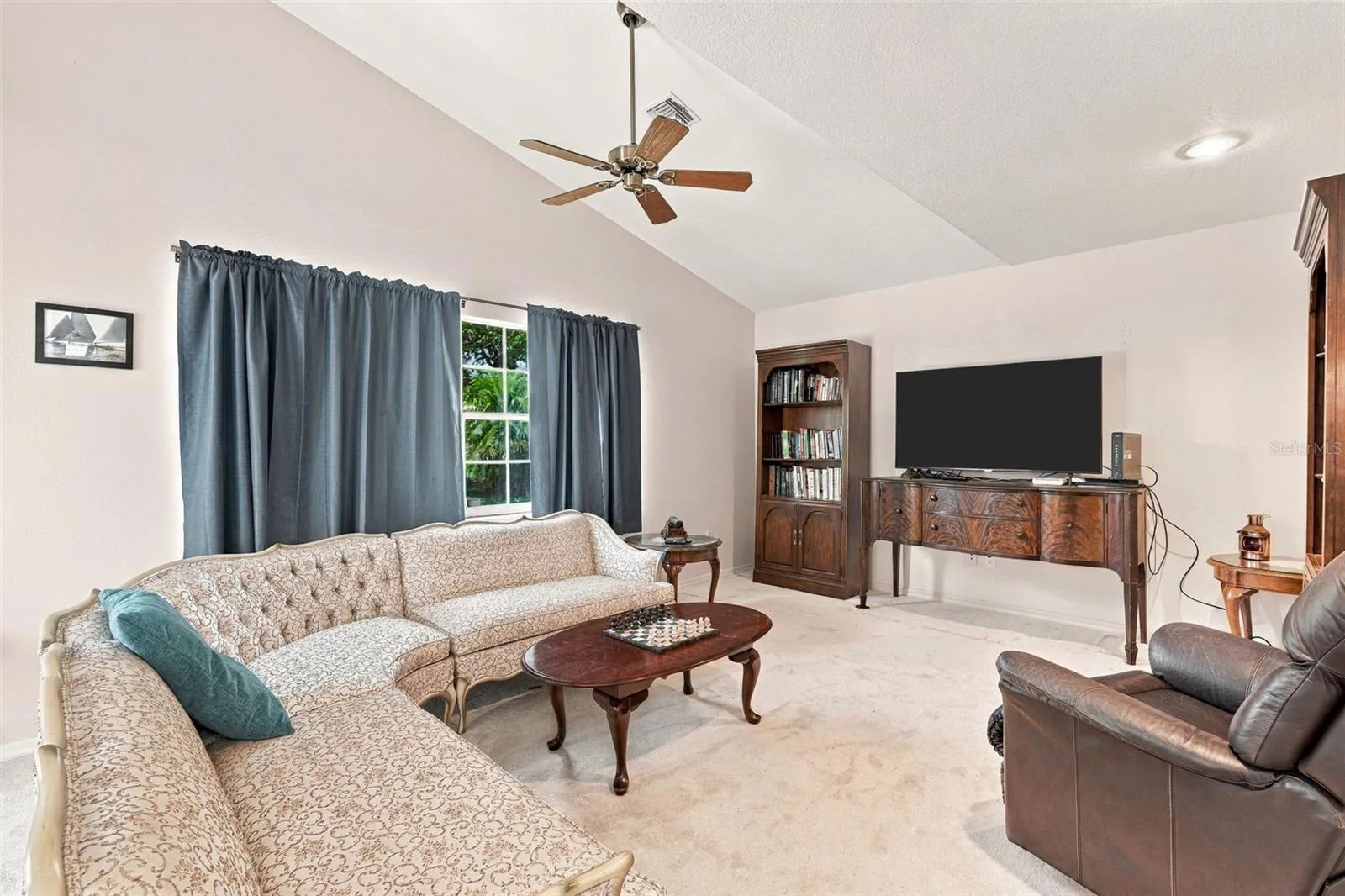 Comfortable Den with Vaulted Ceiling