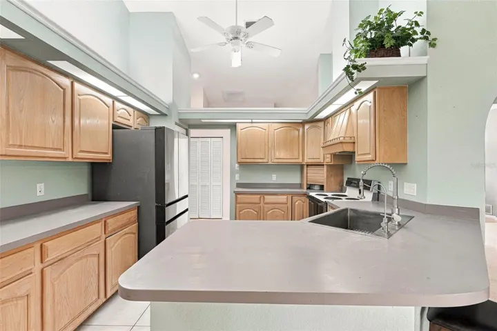 Bright Kitchen Featuring a Convenient Breakfast Bar