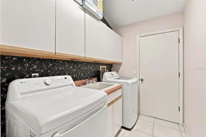 Laundry Room Offers Utility Sink and Extra Storage