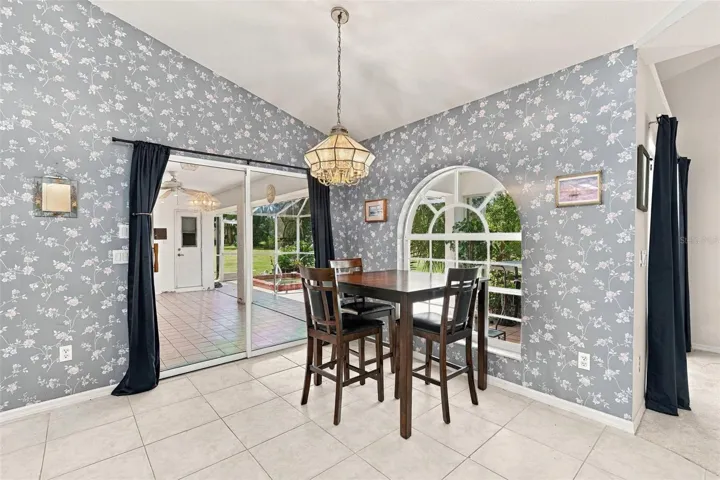 Dining Area with Arched Window and Lanai Access