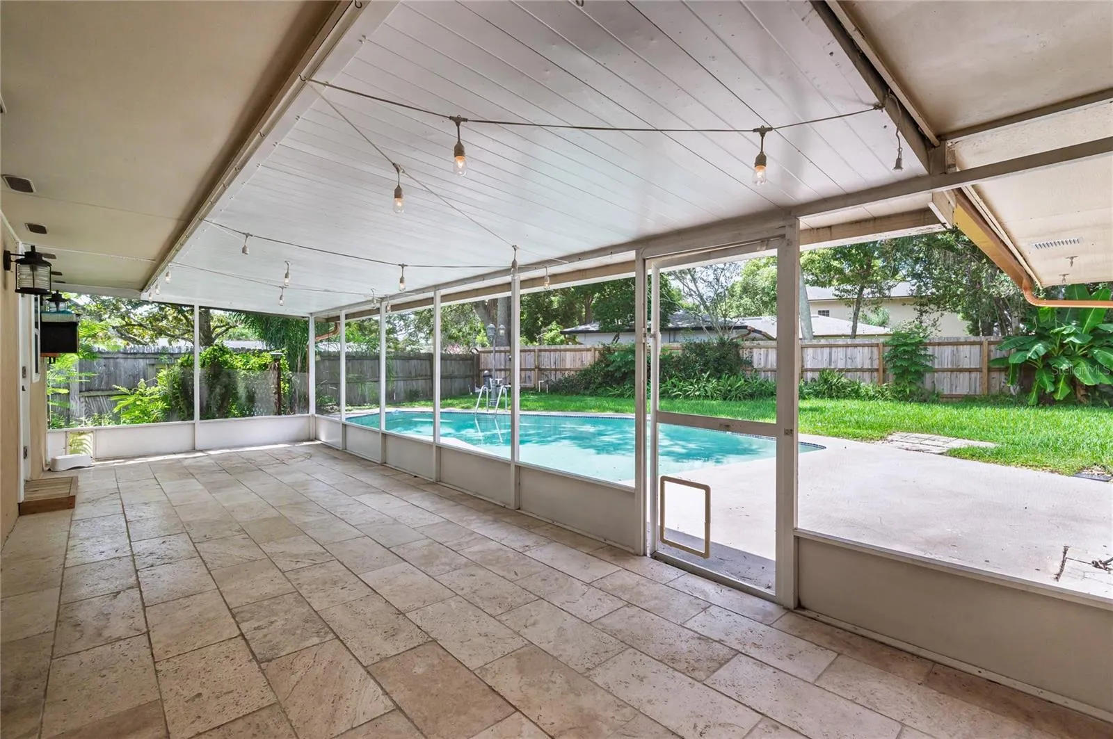 Covered and screened in rear patio...