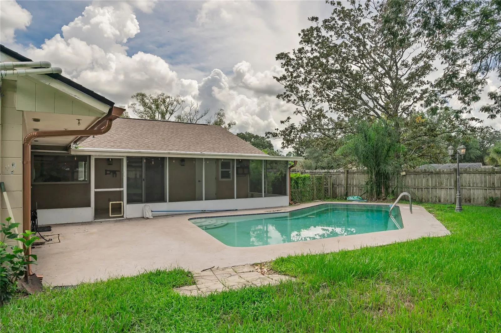 Fenced in backyard and pool