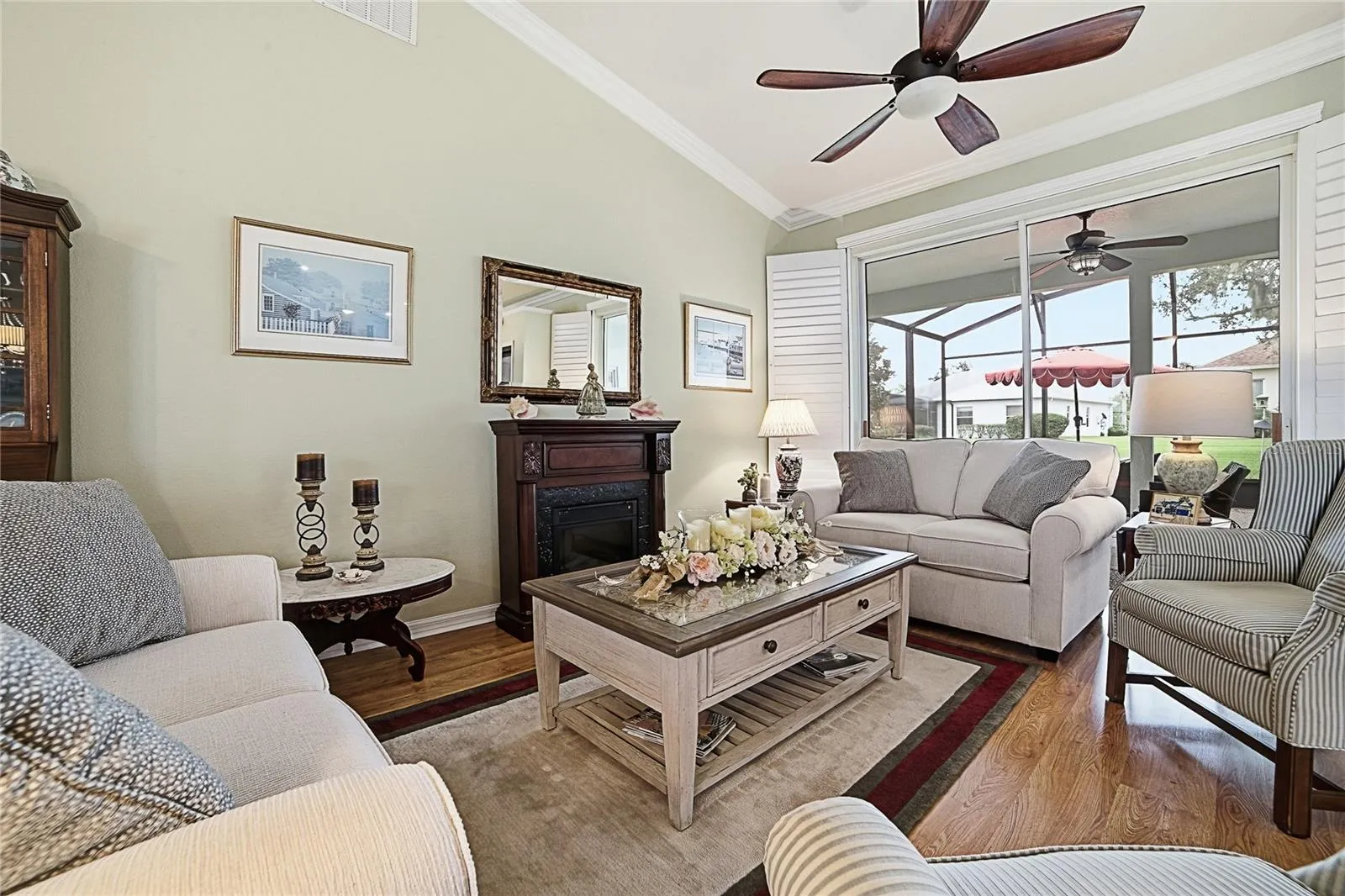 Formal Living Room. This home has Crown Moulding in all the main rooms and Plantation Shutters.