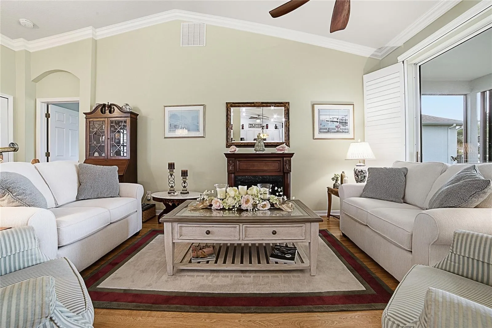 High Ceilings in the Living Room. Crown Moulding, Plantation Shutters