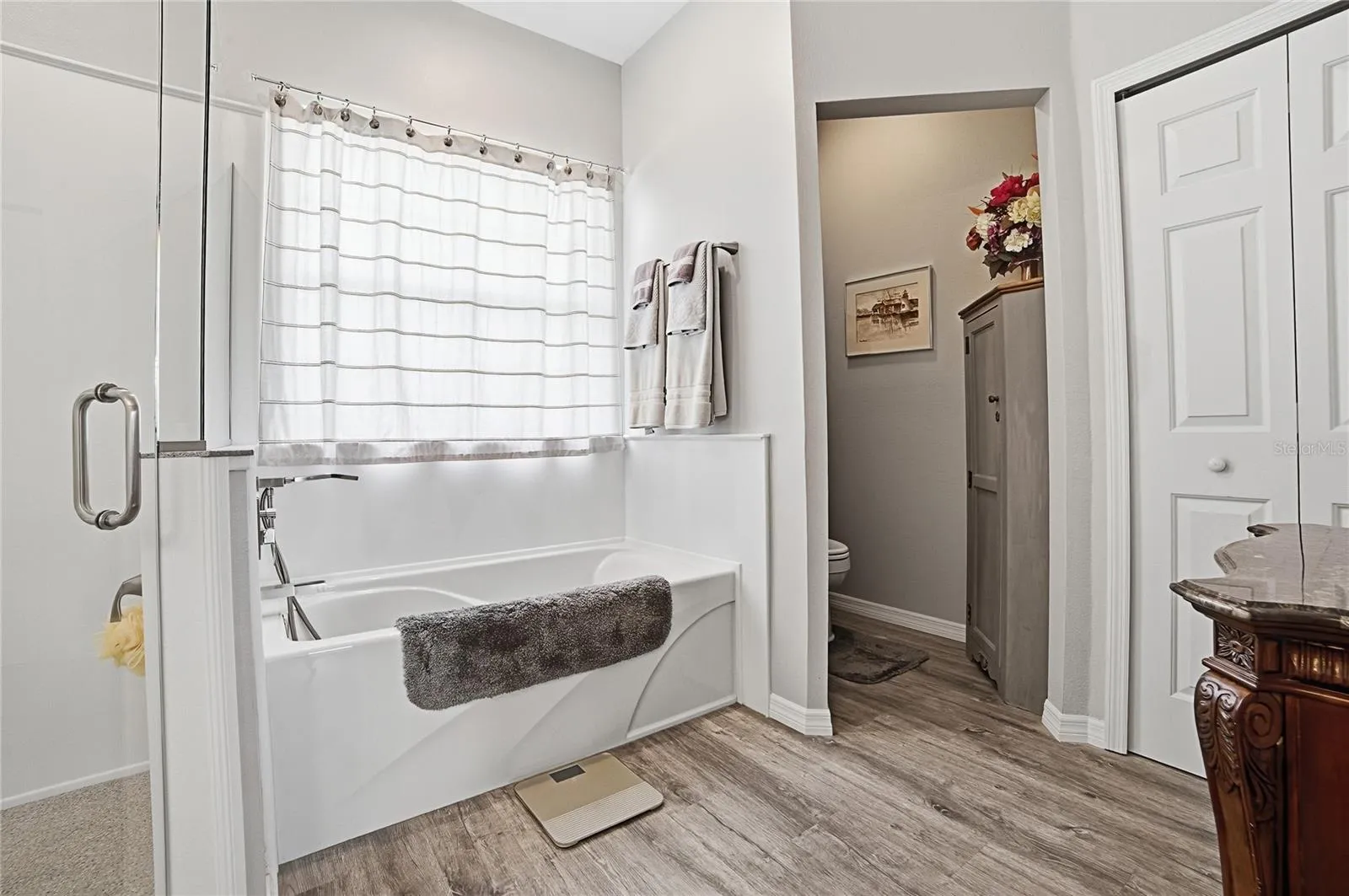 Owners Bathroom with Toilet Closet and Storage
