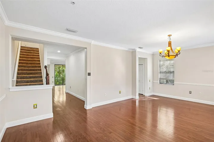 In front room looking towards the stairs leading to the 3rd floor or the hallway to the kitchen area, Half bath and elevator