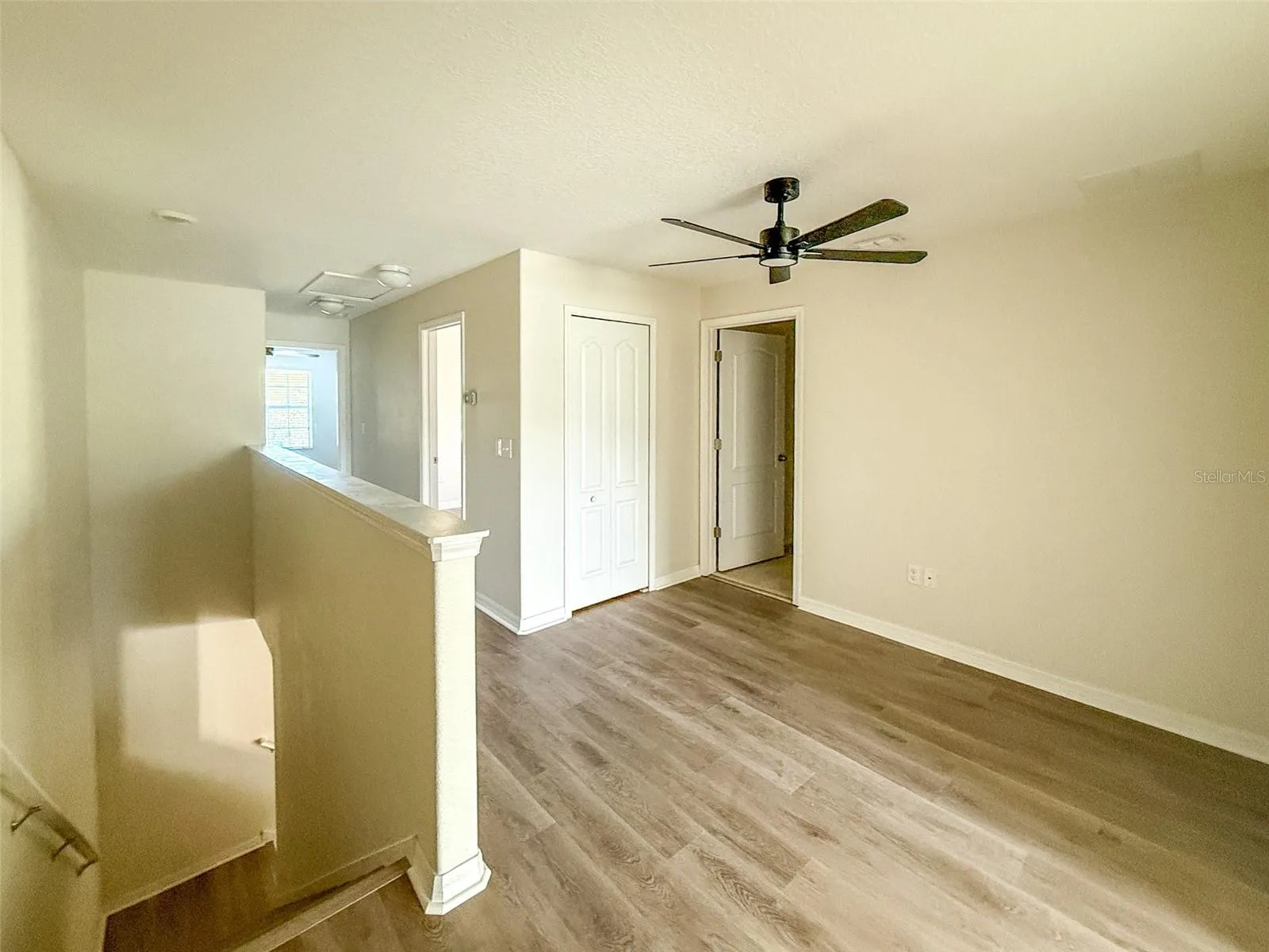 View of loft area at the top of the stairs looking towards the 2nd &amp; 3rd bedrooms &amp; laundry room