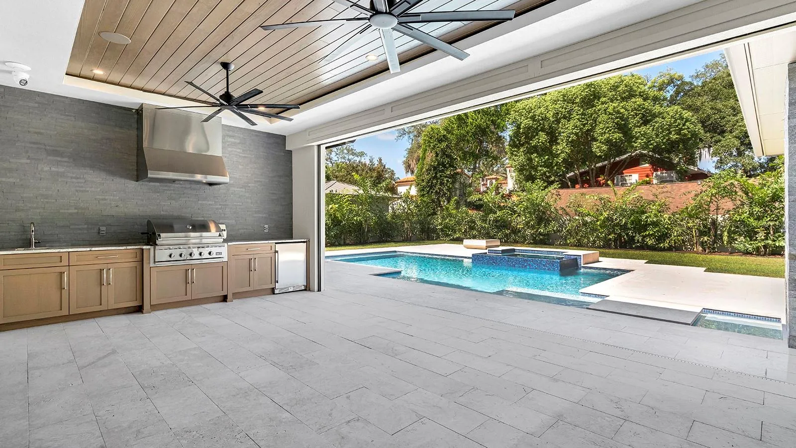 Covered Lanai with Summer Kitchen & Remote Screens